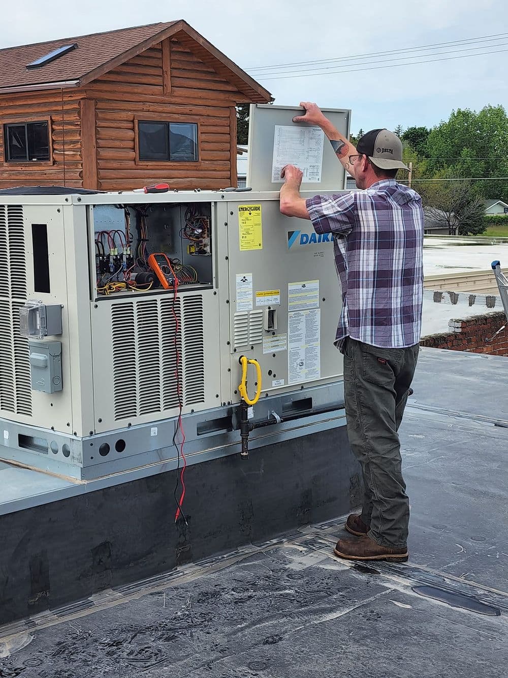 HVAC Technician performing maintenance on a heating system